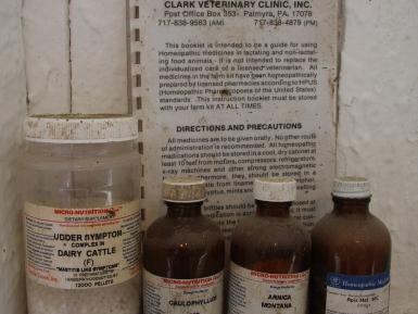 Medicine shelf in the milking parlour - homeopathic medicine for organic dairy cows in New York State, USA